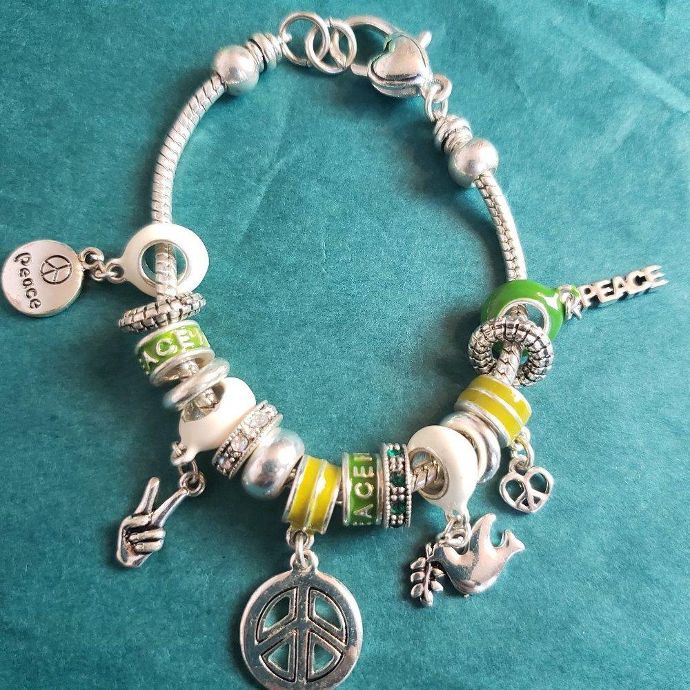 2/25$ $Peace and love charm bracelet silver tone yellow and green